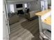 Open living space with a fireplace, comfortable seating, and wood-look floors at 1912 Nebula Dr, Las Vegas, NV 89115