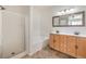 Bathroom with a shower, bathtub, and double sink vanity at 202 Twin Creek St, Henderson, NV 89074
