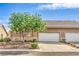 Charming single-story home featuring a well-manicured lawn and a spacious three-car garage at 202 Twin Creek St, Henderson, NV 89074
