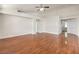 Spacious, open living area featuring wood floors, neutral paint, and access to other rooms at 202 Twin Creek St, Henderson, NV 89074