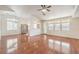 Bright living room with wood floors, vaulted ceilings, and open access to the adjacent dining area at 202 Twin Creek St, Henderson, NV 89074