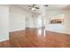Spacious living room boasts vaulted ceilings and hardwood floors, flowing into the open-concept kitchen at 202 Twin Creek St, Henderson, NV 89074