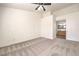 Main bedroom leading to an ensuite bathroom, featuring carpeted floors at 202 Twin Creek St, Henderson, NV 89074