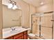 Bathroom featuring a shower, single sink vanity and mirror at 2229 Suffron Hills Ct, Henderson, NV 89044