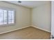 Cozy bedroom with wood floors and plantation shutters allowing natural light at 2229 Suffron Hills Ct, Henderson, NV 89044