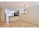 Elegant dining area with a chandelier, seamlessly flowing into the kitchen, perfect for entertaining at 2229 Suffron Hills Ct, Henderson, NV 89044