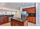 Well-appointed kitchen with stainless steel appliances, a kitchen island, and ample cabinet space for storage at 2229 Suffron Hills Ct, Henderson, NV 89044