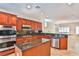 Modern kitchen with a built-in microwave, stainless steel appliances, and granite countertops for stylish cooking at 2229 Suffron Hills Ct, Henderson, NV 89044