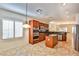 Bright and functional kitchen with stainless appliances and dark wood cabinets, flowing to an eat-in area at 2229 Suffron Hills Ct, Henderson, NV 89044