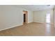 Spacious living room features sleek wood floors and ample natural light from a glass panel door at 2229 Suffron Hills Ct, Henderson, NV 89044