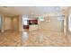 Spacious living area featuring tile floors, recessed lighting, and an open layout into the kitchen at 2229 Suffron Hills Ct, Henderson, NV 89044
