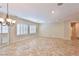 Bright living space with tile flooring, plantation shutters, recessed lights, and a chandelier at 2229 Suffron Hills Ct, Henderson, NV 89044