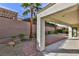 This backyard patio features a brick walkway and rock landscaping for a serene outdoor retreat at 2229 Suffron Hills Ct, Henderson, NV 89044