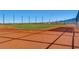 Well-maintained baseball field with dirt infield, green outfield, and tall fencing at 2664 Ornate Regiment St, Henderson, NV 89044