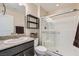 Bathroom featuring granite counters, and a glass enclosed shower for a modern, clean aesthetic at 2664 Ornate Regiment St, Henderson, NV 89044