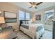 Well-lit bedroom with a queen-sized bed and elegant decor at 2664 Ornate Regiment St, Henderson, NV 89044
