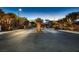 Community entrance with gate; featuring well-maintained landscaping and neighborhood signage at 2664 Ornate Regiment St, Henderson, NV 89044