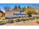 Community entrance sign for Inspirada, set amongst desert landscaping and mature trees at 2664 Ornate Regiment St, Henderson, NV 89044