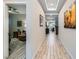 Elegant hallway with decorative lighting and views of the living and dining spaces at 2664 Ornate Regiment St, Henderson, NV 89044