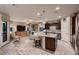 This open concept living space has wood-look floors and plenty of seating at 2664 Ornate Regiment St, Henderson, NV 89044