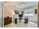 Bright home office featuring a modern glass desk and ample natural light at 2664 Ornate Regiment St, Henderson, NV 89044