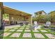 Outdoor patio with cozy seating, stylish pavers, and a cozy fire pit for a luxurious outdoor experience at 2664 Ornate Regiment St, Henderson, NV 89044