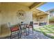 Outdoor patio featuring a covered seating area and stylish landscaping for relaxation and entertaining at 2664 Ornate Regiment St, Henderson, NV 89044