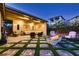 Covered patio with comfortable seating, a fire pit, and elegant design at 2664 Ornate Regiment St, Henderson, NV 89044