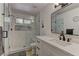 Modern bathroom featuring a glass-enclosed shower, sleek vanity, and stylish fixtures at 2739 Darby Falls Dr, Las Vegas, NV 89134