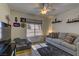 Comfortable bedroom with neutral tones, large window, and cozy seating area at 2739 Darby Falls Dr, Las Vegas, NV 89134