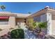Home entrance showing well maintained landscaping and small patio area at 2739 Darby Falls Dr, Las Vegas, NV 89134