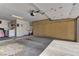 Spacious garage with ample storage, including built in cabinets, washer, dryer, and utility sink at 2739 Darby Falls Dr, Las Vegas, NV 89134