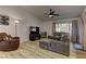 Cozy living room featuring modern furniture, hardwood floors, and bright natural light at 2739 Darby Falls Dr, Las Vegas, NV 89134