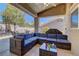 Inviting covered patio with comfortable seating, perfect for outdoor relaxation and entertaining with desert landscaping at 2739 Darby Falls Dr, Las Vegas, NV 89134