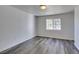 This bedroom has new gray floors and a window for lots of natural light at 3318 N Decatur Blvd # 2138, Las Vegas, NV 89130