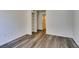 Bedroom featuring new gray floors, closet with shelving, and a doorway at 3318 N Decatur Blvd # 2138, Las Vegas, NV 89130