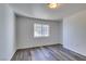 This bedroom features new gray floors and a window for lots of natural light at 3318 N Decatur Blvd # 2138, Las Vegas, NV 89130