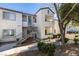 Charming condo building with stair access, lush landscaping, and well-maintained exterior on a sunny day at 3318 N Decatur Blvd # 2138, Las Vegas, NV 89130