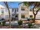 Low-rise condo building featuring well-maintained landscaping and exterior finishes, providing an inviting curb appeal at 3318 N Decatur Blvd # 2138, Las Vegas, NV 89130