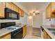 Galley kitchen with views into the dining area at 3318 N Decatur Blvd # 2138, Las Vegas, NV 89130