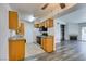 Bright kitchen features oak cabinets, white appliances, and easy access to living room and dining area at 3318 N Decatur Blvd # 2138, Las Vegas, NV 89130