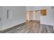 Bright and airy living room with stylish flooring, ceiling fan, and bathroom access at 3318 N Decatur Blvd # 2138, Las Vegas, NV 89130