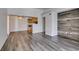 Inviting living room features wood-look flooring, a ceiling fan, and an open layout to the kitchen at 3318 N Decatur Blvd # 2138, Las Vegas, NV 89130