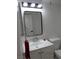 Bathroom features a modern black framed mirror over a white vanity at 3484 Nightflower Ln # 2, Las Vegas, NV 89121