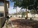 View of the exterior showcasing a meticulously kept lawn and decorative trees at 3484 Nightflower Ln # 2, Las Vegas, NV 89121