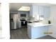 Bright kitchen featuring stainless steel appliances, white countertops and blue cabinets at 3484 Nightflower Ln # 2, Las Vegas, NV 89121