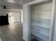 Bright living room with sliding glass doors and view of shelves and storage area at 3484 Nightflower Ln # 2, Las Vegas, NV 89121