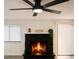 Living room featuring a stone fireplace and a ceiling fan at 3484 Nightflower Ln # 2, Las Vegas, NV 89121