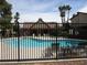 Community pool area with a clubhouse and comfortable seating at 3484 Nightflower Ln # 2, Las Vegas, NV 89121