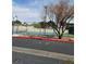 Community tennis court with a blue playing surface and surrounding fence at 3484 Nightflower Ln # 2, Las Vegas, NV 89121